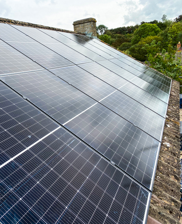 Roof mounted domestic solar PV panels generating renewable energy